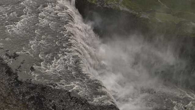Slow motion over the most powerful waterfall in Iceland aerial shot cloudy day 