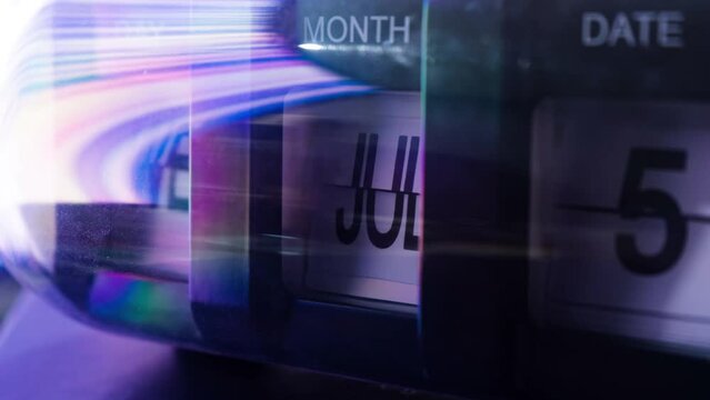 Time lapse of calendar clock in 1 year in futuristic lighting. Time travel concept.