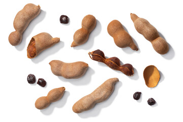 Tamarind pods (Tamarindus indica fruits): whole, cracked, seeds. Top view, isolated png - obrazy, fototapety, plakaty