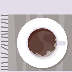 White cup of coffee on a checkered plaid