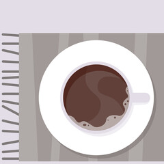 White cup of coffee on a checkered plaid