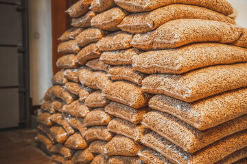 A pile of sacks full of wood pellets