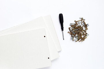 Tools for furniture assembly on white background. Copy space