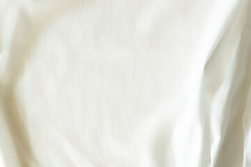 White crumpled linen fabric texture background. Natural linen organic eco textiles canvas background. Top view
