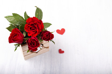 Bouquet of red roses and hearts