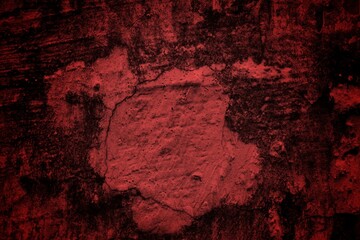 A textured background featuring deep red tones with a distressed, grunge appearance. The surface shows scratches and uneven patterns, creating a vintage feel.