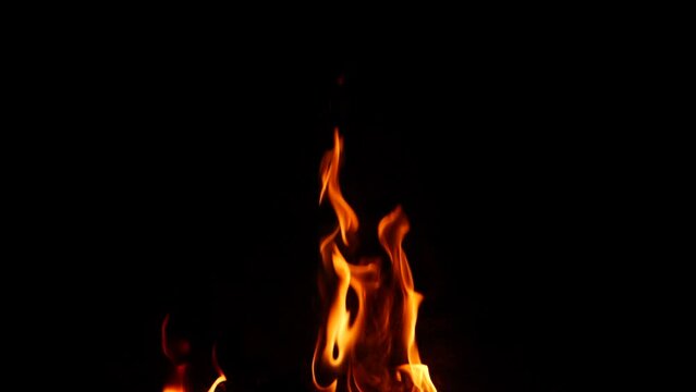 Fire burning, slight flames going upwards, black background
