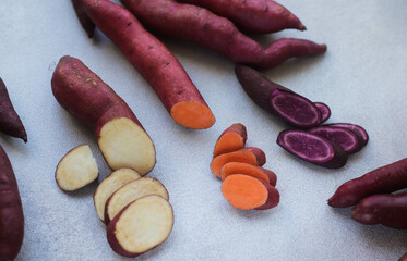 sweet potato organic multicolored closeup on a gray surface top view