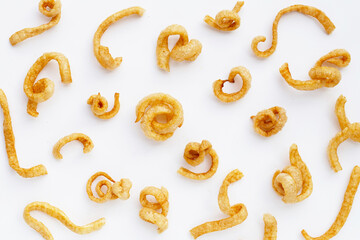 Fried crispy pork rinds on white background.