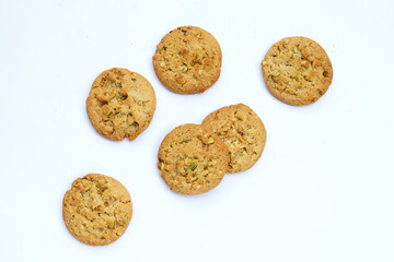 pistachio and almond cookies on white background.