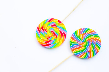 Rainbow lollipop on white background.
