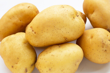 Fresh patatoes on white background.