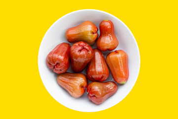 Fresh rose apple on yellow background.