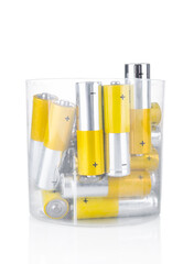 Pile of used alkaline batteries on a white background