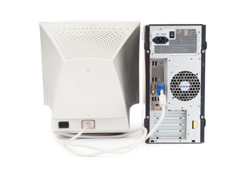 Old, vintage PC monitor with system unit on white background