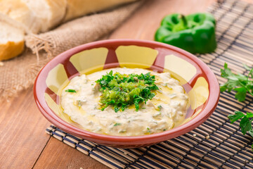 Beiruti hummus served in dish isolated on table side view of arabic food