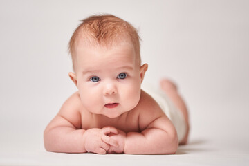 portrait of a child on a white background looking into the camera