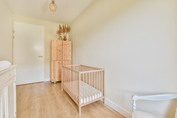 Interior of a room with a wooden crib