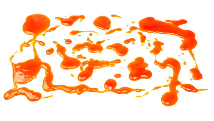 Orange sauce splashes isolated on white background. Top view.