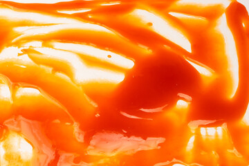 Red sauce splashes as background.