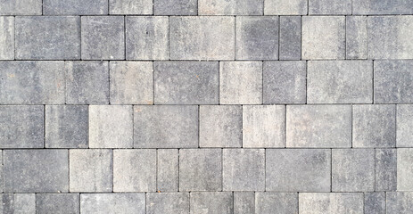 Gray paving stones. Paving surface road. Texture made of big gray cement bricks. Brick stone street road - pavement texture effect - 553815638