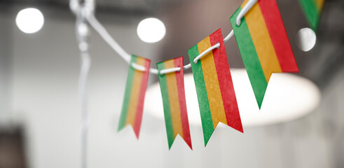 A garland of Bolivia national flags on an abstract blurred background