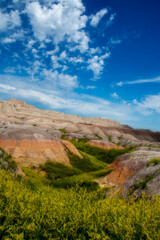 The rugged mountains of the Badlands. These geologic deposits contain one of the world’s richest fossil beds. Ancient mammals such as the rhino, horse, and saber-toothed cat once roamed here