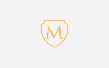 Shield protection symbol and royal luxury shield monogram design. shield protection logo with letter M