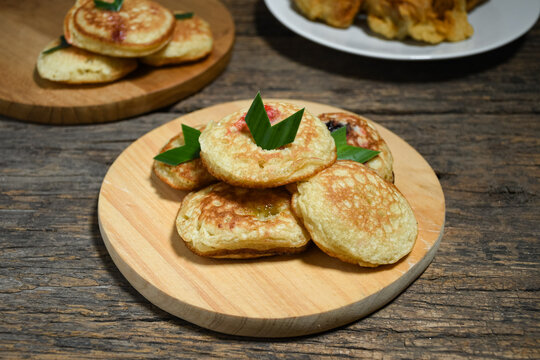 Kue Khamir or samir or Khamir cake on wooden plate. Khamir cake is a traditional snack from Pemalang, Indonesia. This cake is made from flour, butter and egg dough. Selective Focus