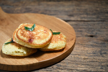 Kue Khamir or samir or Khamir cake on wooden plate. Khamir cake is a traditional snack from Pemalang, Indonesia. This cake is made from flour, butter and egg dough. Selective Focus