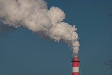 Color chimney with white smoke and blue background