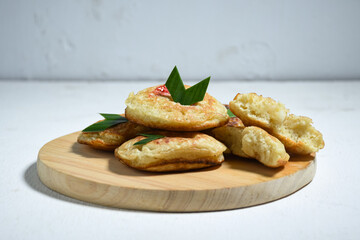 Kue Khamir or samir or Khamir cake on wooden plate. Khamir cake is a traditional snack from Pemalang, Indonesia. This cake is made from flour, butter and egg dough. Selective Focus