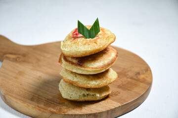 Kue Khamir or samir or Khamir cake on wooden plate. Khamir cake is a traditional snack from Pemalang, Indonesia. This cake is made from flour, butter and egg dough. Selective Focus