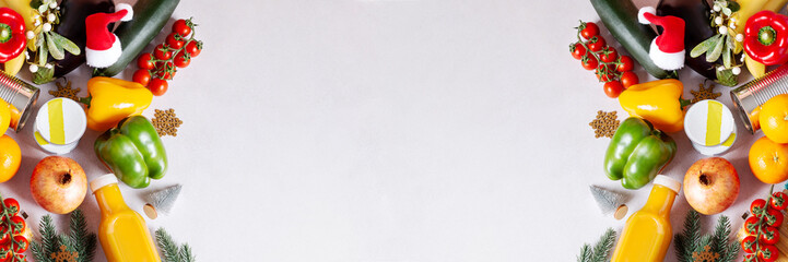 Canned food, pasta, fruits and vegetables for donation decorated for Christmas, charity concept