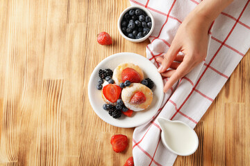 Concept of tasty sweet food, cheese pancakes, space for text