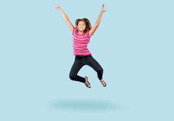 Fototapeta na wymiar Energetic cute child jumping and posing