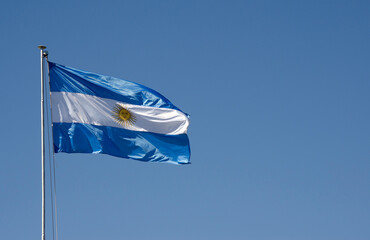 Argentinian flag waving. symbol of the argentine republic with blue sky in the background