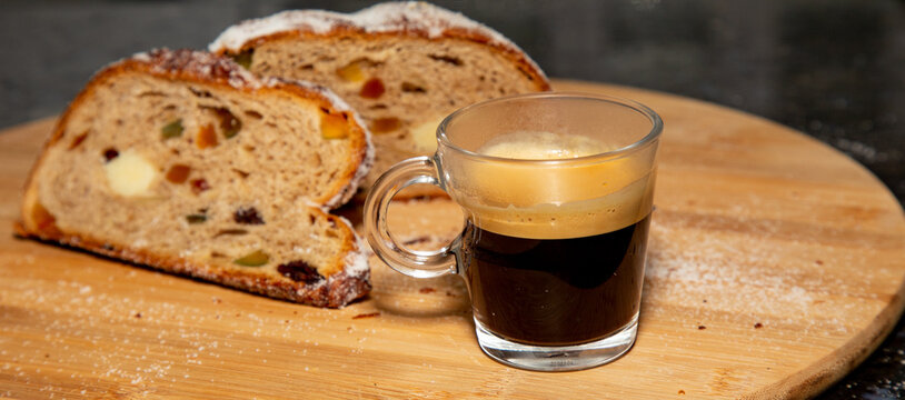 Traditional German Christmas stollen with natural fermentation. handmade german panettone portrait with coffee