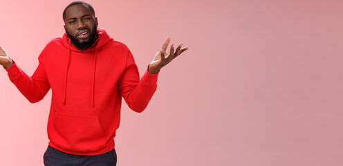 Bothered pissed african american bearded boyfriend in red hoodie arguing standing questioned...