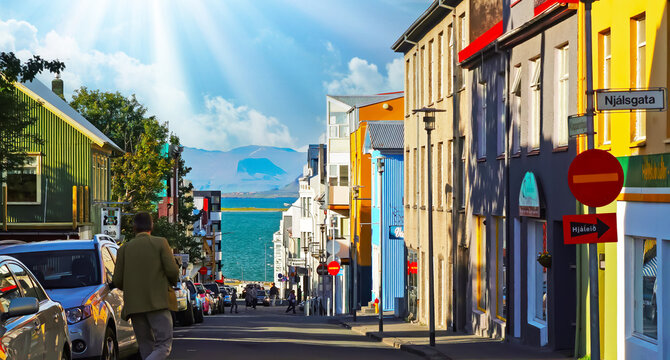 Reykjavik (Njalsgata), Iceland - July 28. 2008: Coastal city residential street to sea harbour with typical colorful icelandic houses