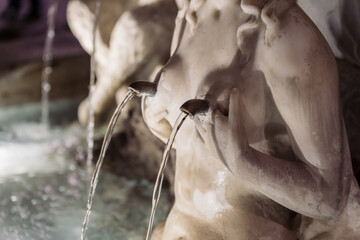 Close-up of a marble fountain statue with water streams in Amalfi, Amalfi Coast, Italy