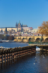 Fototapeta premium Snowy Prague Lesser Town with Prague Castle above River Vltava in the sunny Day , Czech republic