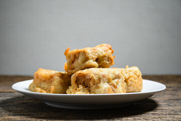Gorengan or Fried tofu on a white plate. Fried food is one of the favorite snacks in Indonesia