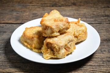 Gorengan or Fried tofu on a white plate. Fried food is one of the favorite snacks in Indonesia