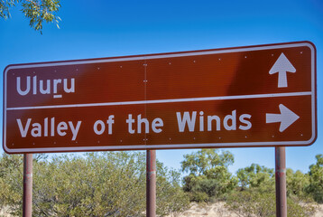 Fototapeta premium Uluru and Valley of the Winds street sign in Ayers Rock, Australia