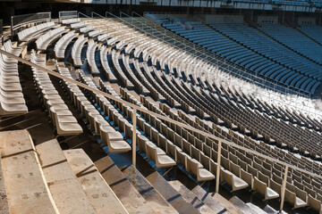 Rows of empty seats in a sports stadium.