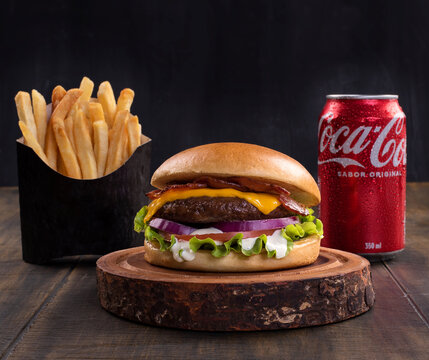 RIO DE JANEIRO, BRAZIL - DECEMBER 14, 2022: Delicious cheeseburger with coca cola drink and french fries.