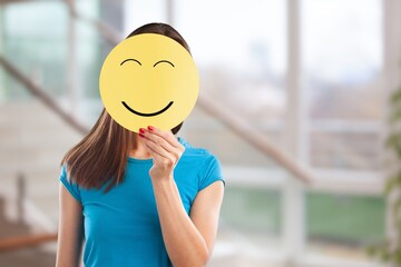 Human hands with happy face card, customer review concept