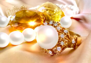 Fototapeta na wymiar gold jewelry white pearl and yellow citrin gem stones woman fashion 