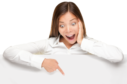 Advertising banner sign - woman excited pointing looking down on empty blank billboard paper sign board. Young business woman isolated cutout PNG on transparent background.